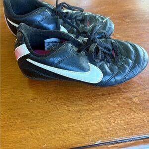Nike Girl’s Black Soccer Cleats with White Swoosh and Pink Accent